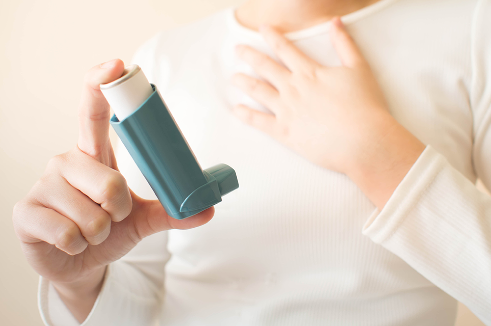 person holding inhaler